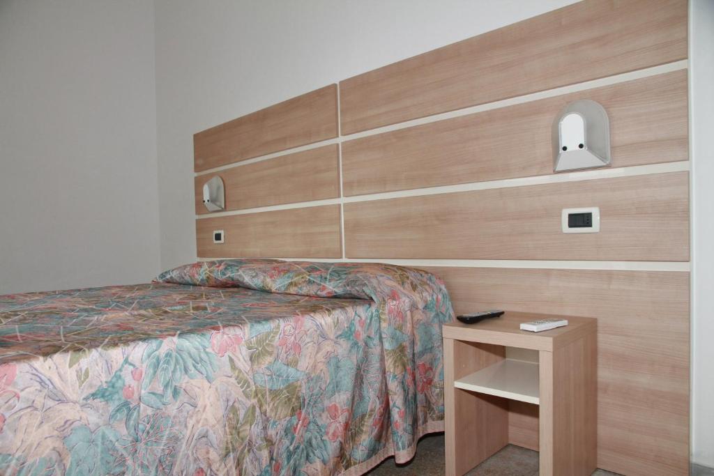 เตียงในห้องที่ Hotel Villa Arlotti
