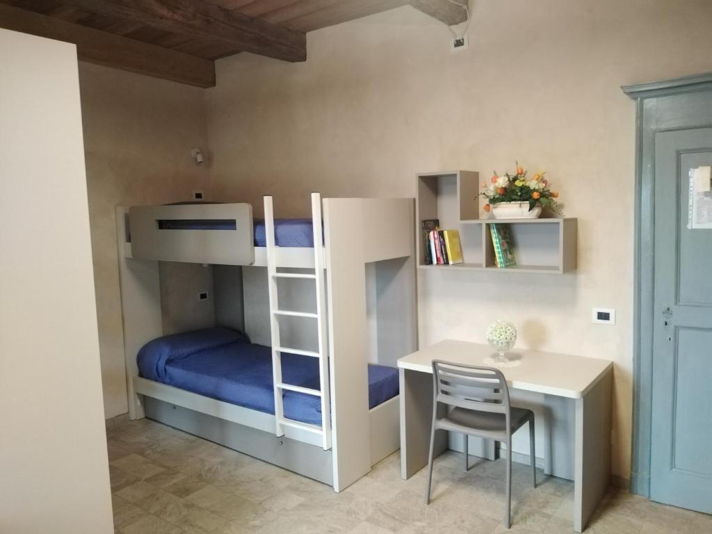 Postel nebo postele na pokoji v ubytování Ostello del Monastero