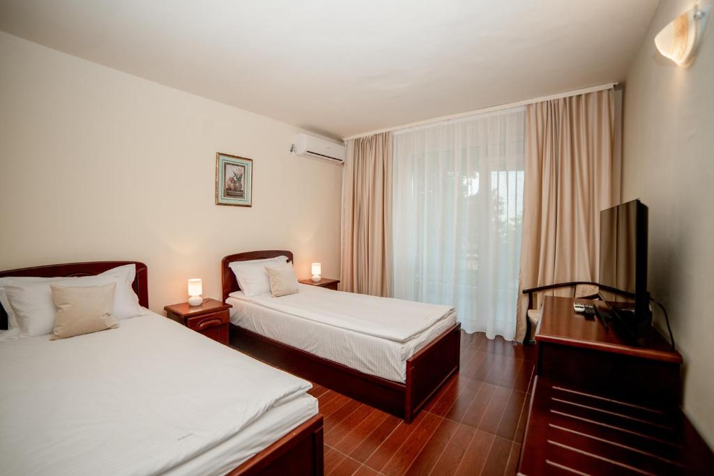 Postel nebo postele na pokoji v ubytování Hotel Corina