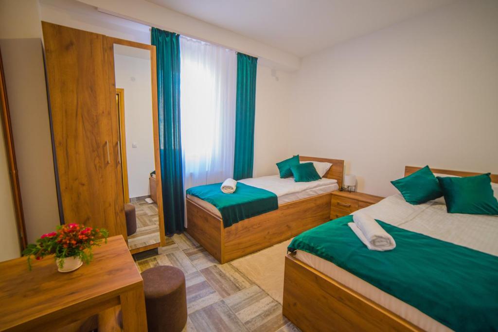 Postel nebo postele na pokoji v ubytování Užički konak
