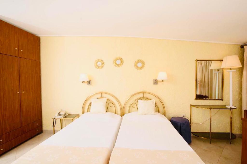 Posteľ alebo postele v izbe v ubytovaní Kommeno Bay Apartments