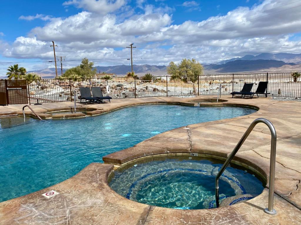 a swimming pool with a hot tub in a resort at Delight's Hot Springs Resort in Tecopa