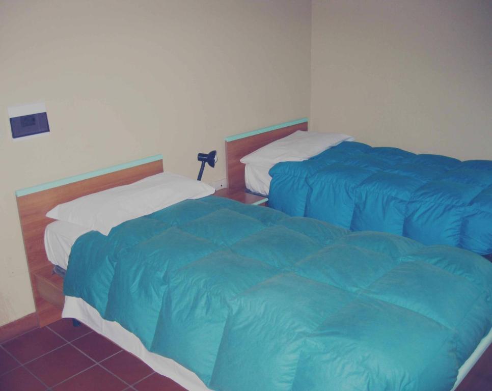 Postel nebo postele na pokoji v ubytování La Locanda del Convento