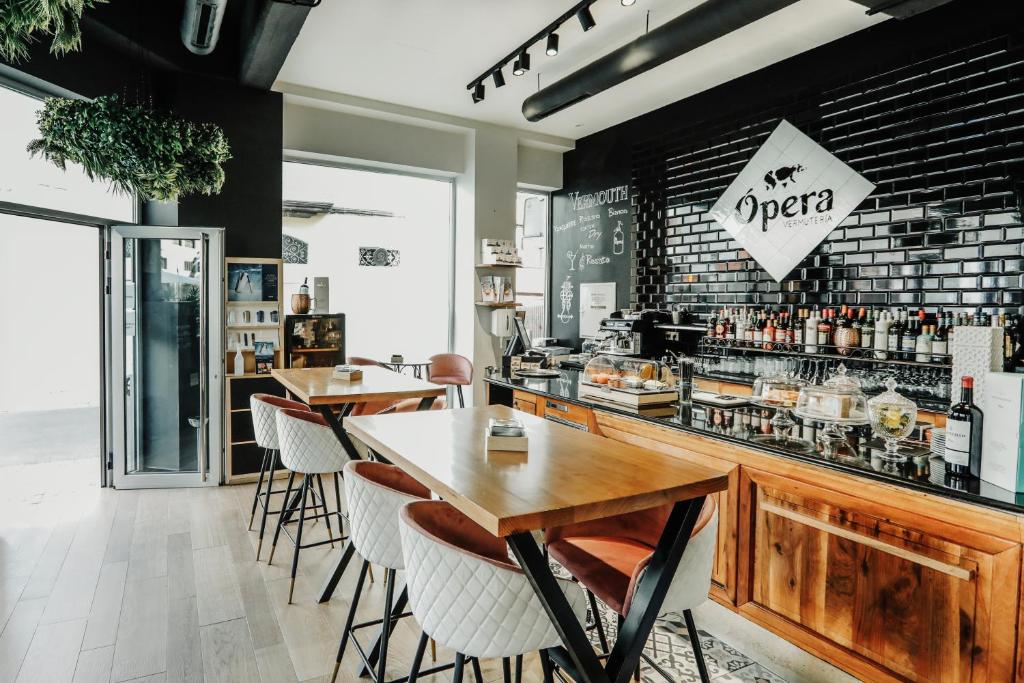a restaurant with two tables and a bar at Urban Anaga Hotel in Santa Cruz de Tenerife