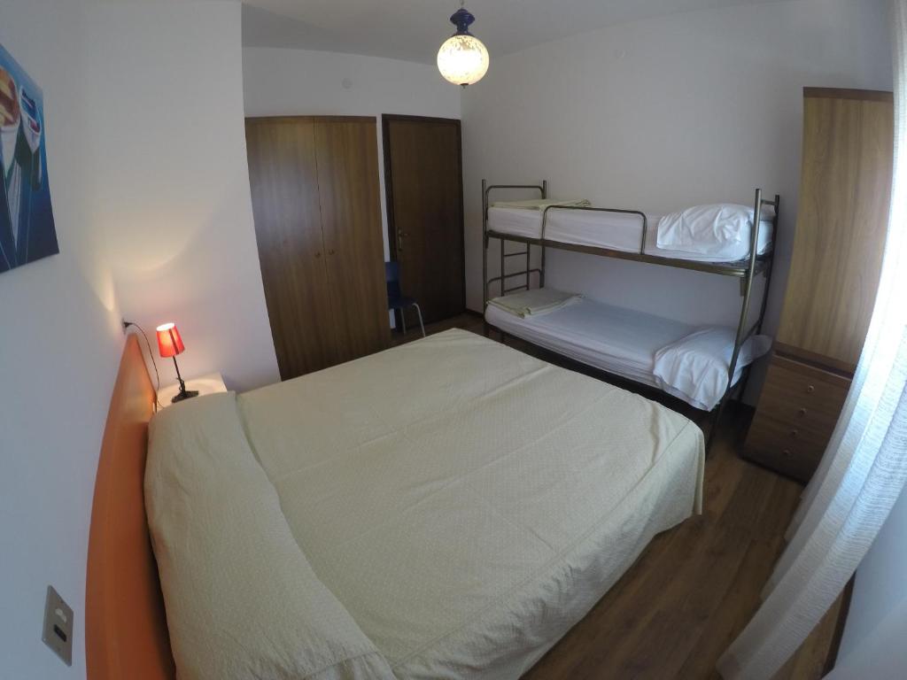 Postel nebo postele na pokoji v ubytování Residence Caorle Apartments - Agenzia Cocal