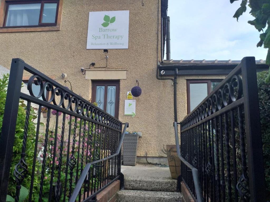 un edificio con un cartello sul lato di Levens Terrace, Barrow Spa Therapy a Barrow in Furness