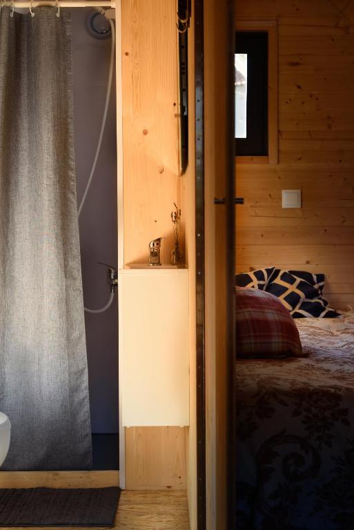Postel nebo postele na pokoji v ubytování Glamping Hills