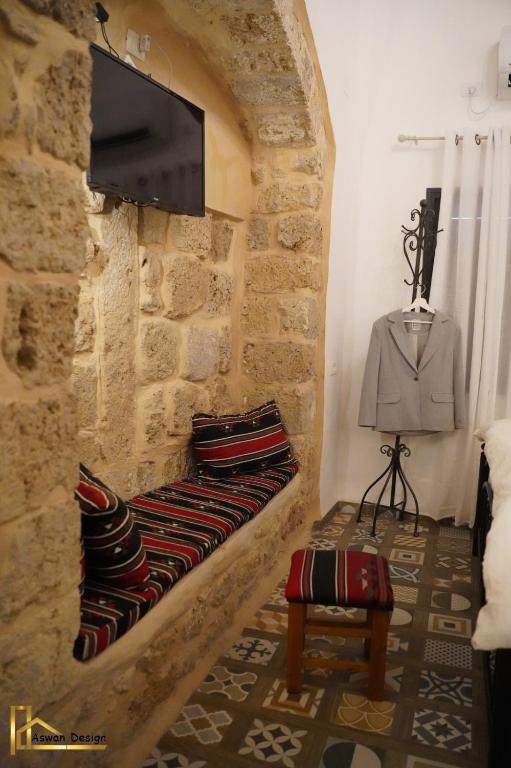 Postel nebo postele na pokoji v ubytování تاج عكا Taj Akko