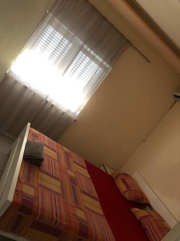 Posteľ alebo postele v izbe v ubytovaní Guesthouse Adriatic
