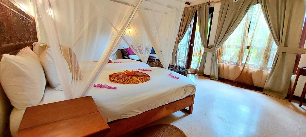 Postel nebo postele na pokoji v ubytování Kena Beach Hotel