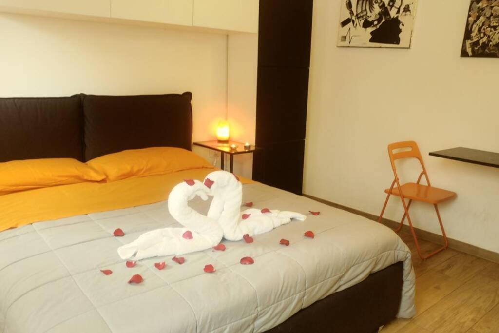 A bed or beds in a room at House of the Rising Sun