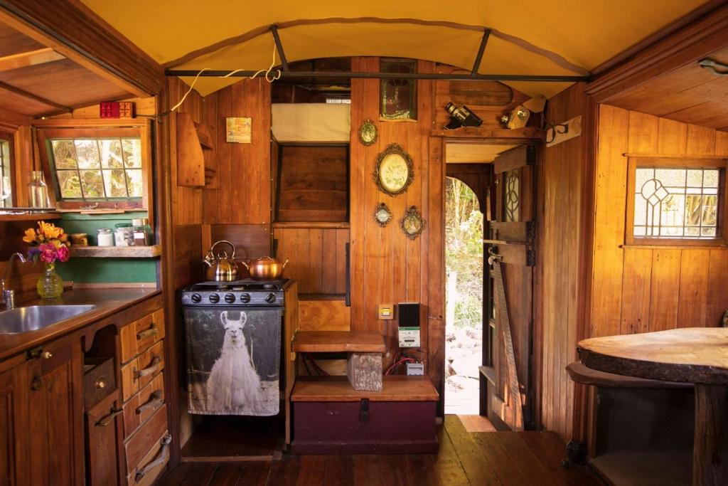 a kitchen with an old stove and a sink at Alpacas Off Grid - House Truck in Takaka