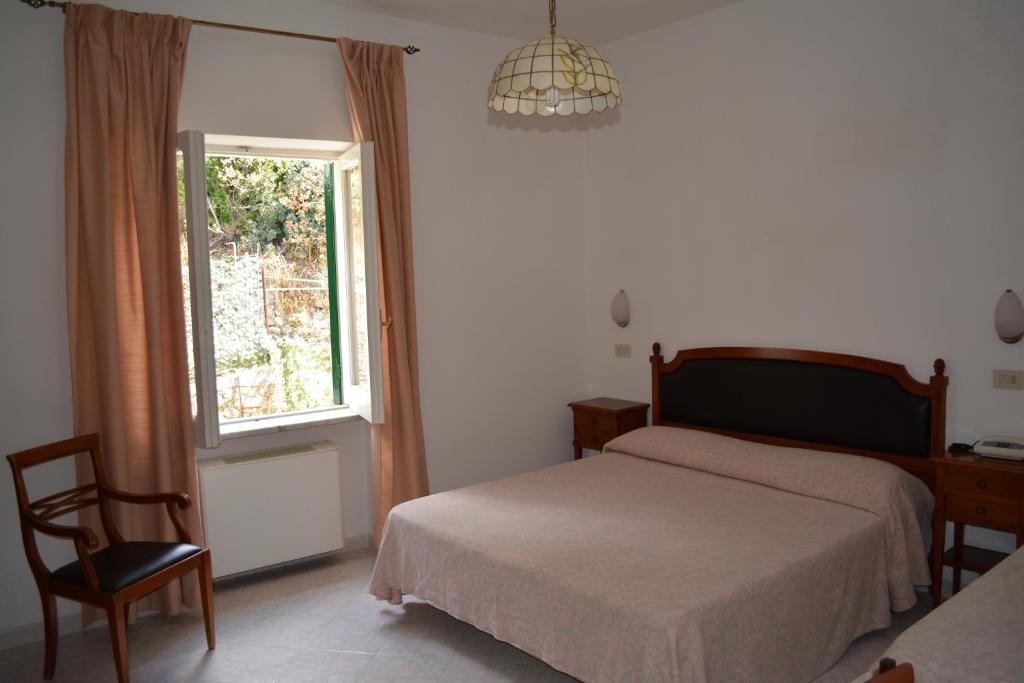 Postel nebo postele na pokoji v ubytování Hotel Maronti