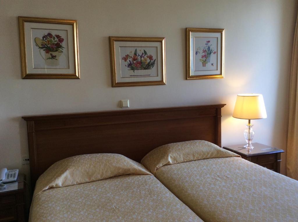 Voodi või voodid majutusasutuse Cavalieri Hotel toas