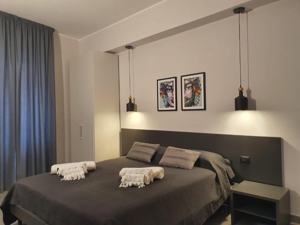 Postel nebo postele na pokoji v ubytování Charme Rooms Siracusa