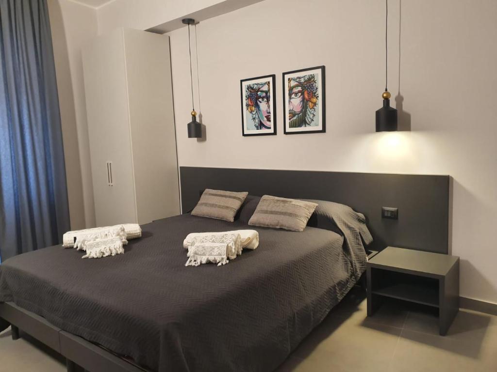 Postel nebo postele na pokoji v ubytování Charme Rooms Siracusa