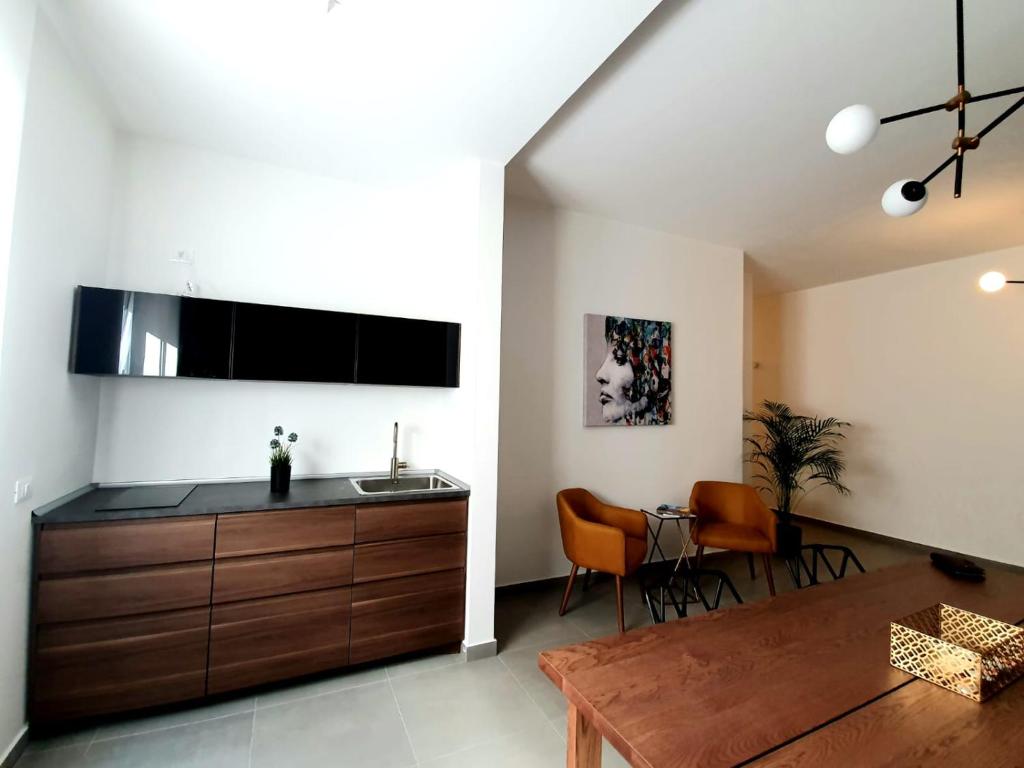 TV a/nebo společenská místnost v ubytování Charme Rooms Siracusa