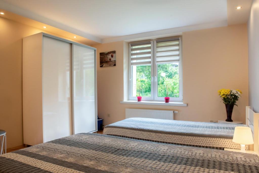 Posteľ alebo postele v izbe v ubytovaní Apartament u Janka