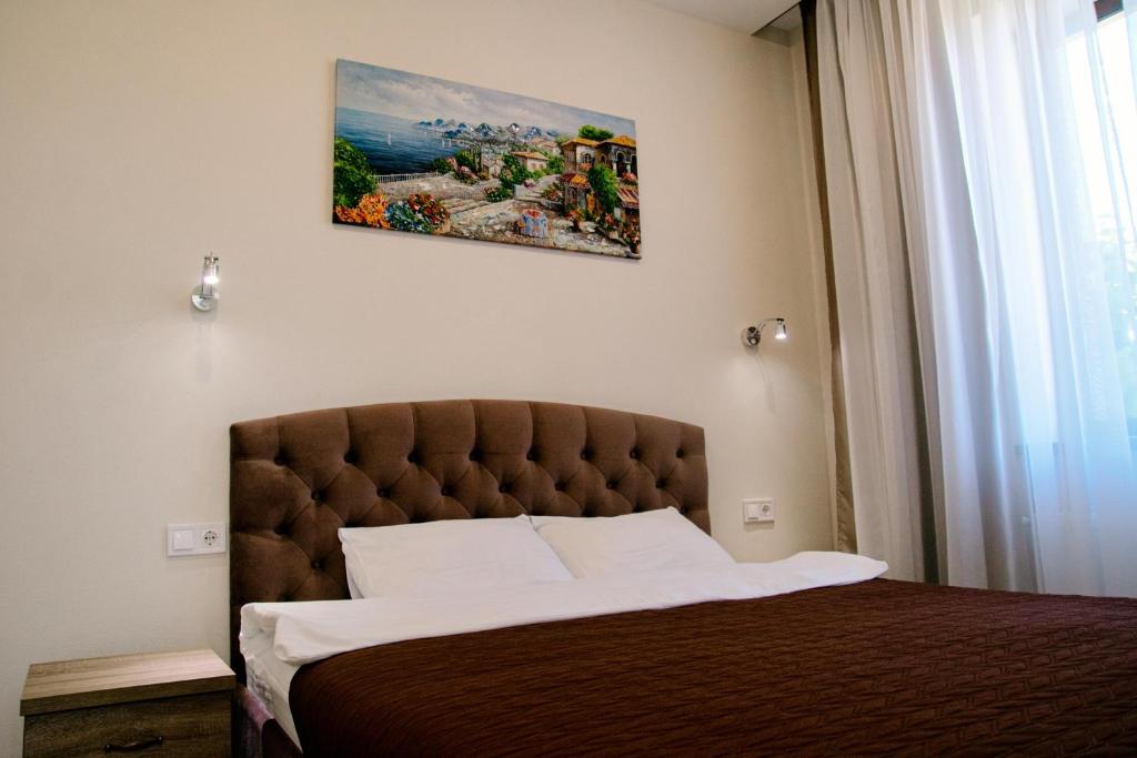 Postel nebo postele na pokoji v ubytování Oasis family apartments