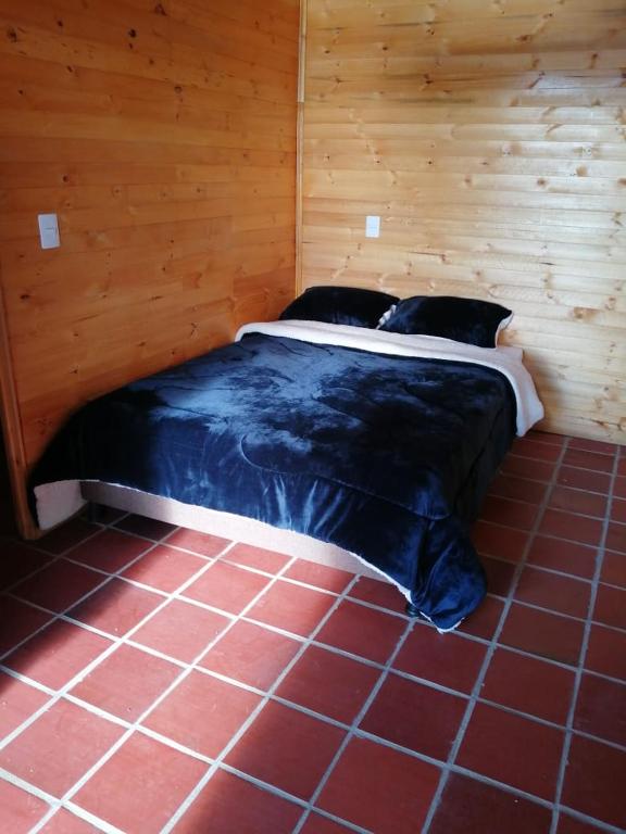 Postel nebo postele na pokoji v ubytování Guatavita Campestre Suites