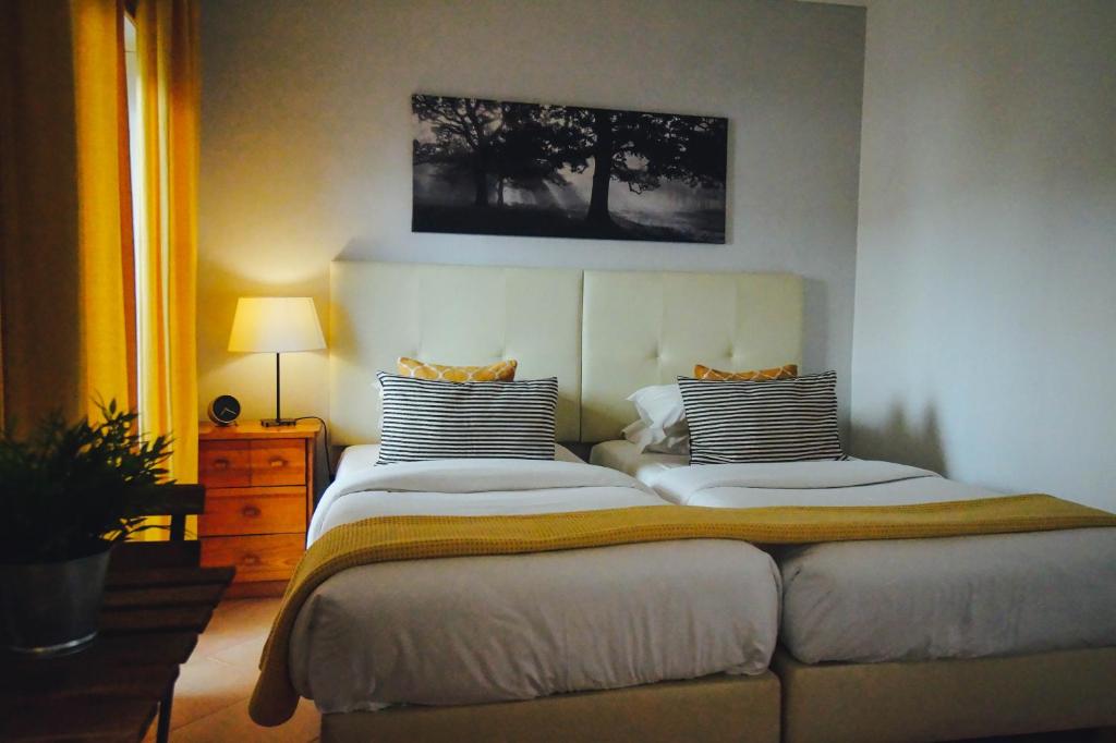 Postel nebo postele na pokoji v ubytování Oasis Beach Apartments