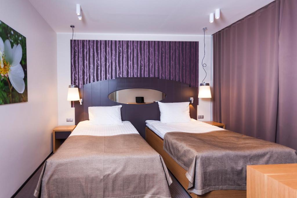 Postel nebo postele na pokoji v ubytování Paide SPA Hotell