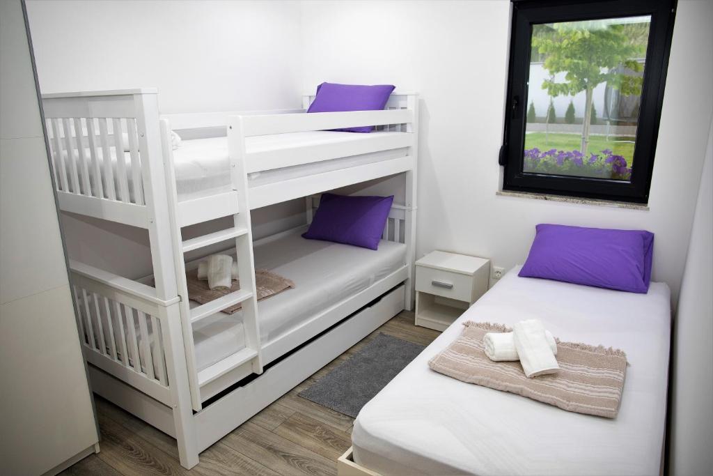 Postel nebo postele na pokoji v ubytování Luxury Villa Magic