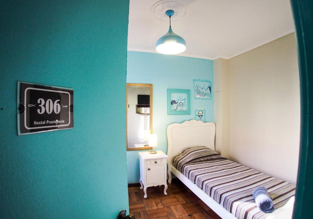 Postel nebo postele na pokoji v ubytování Hostal Providencia