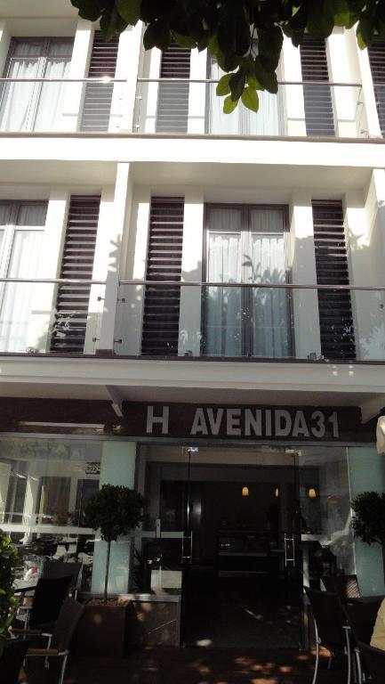 a building with a sign that reads h avaza at Hotel Avenida 31 in Marbella