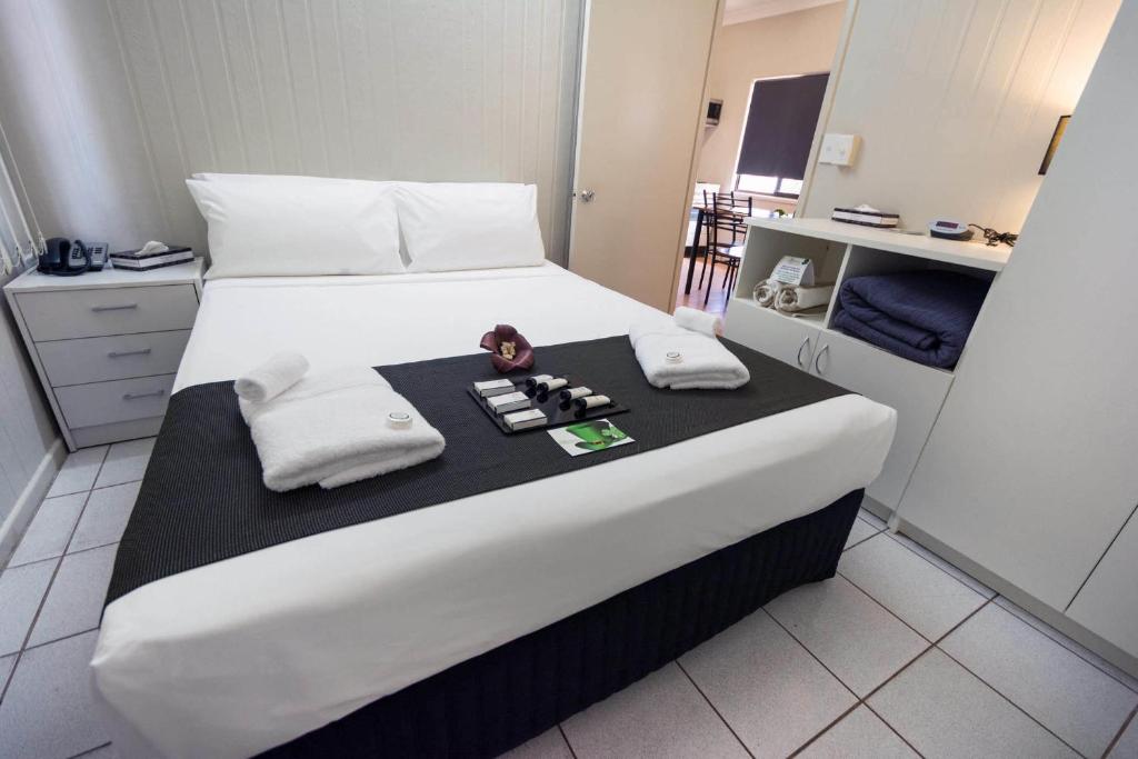 Postel nebo postele na pokoji v ubytování Darwin Resort