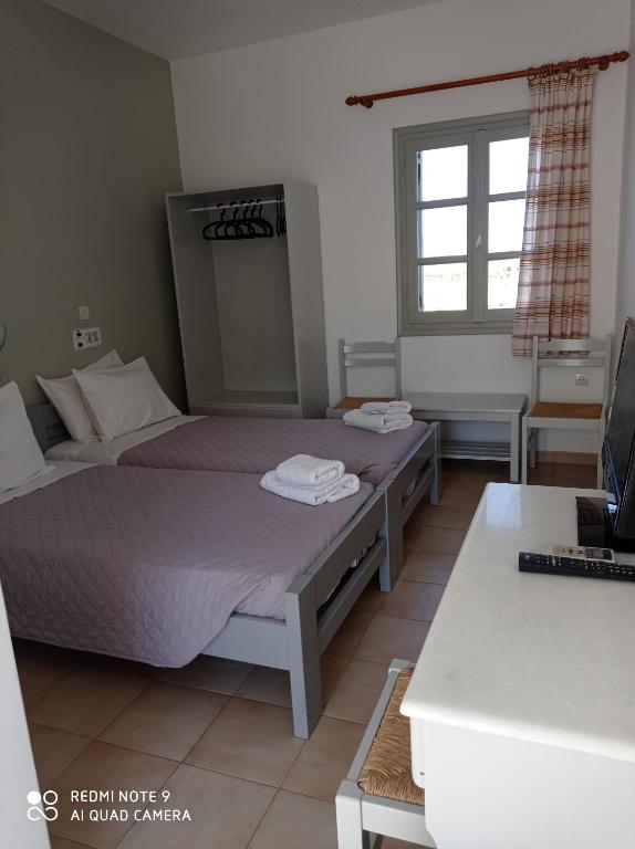 Postel nebo postele na pokoji v ubytování Summer Shades Hotel - ex Arkoulis