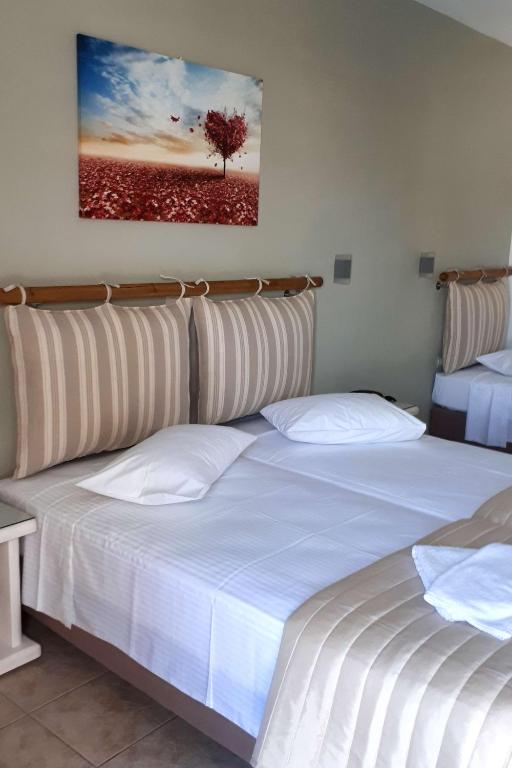 Postel nebo postele na pokoji v ubytování Summer Shades Hotel - ex Arkoulis