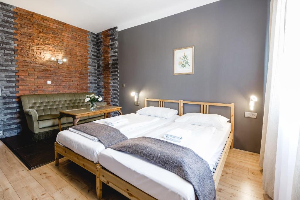 Postel nebo postele na pokoji v ubytování Hotel Hoffinger