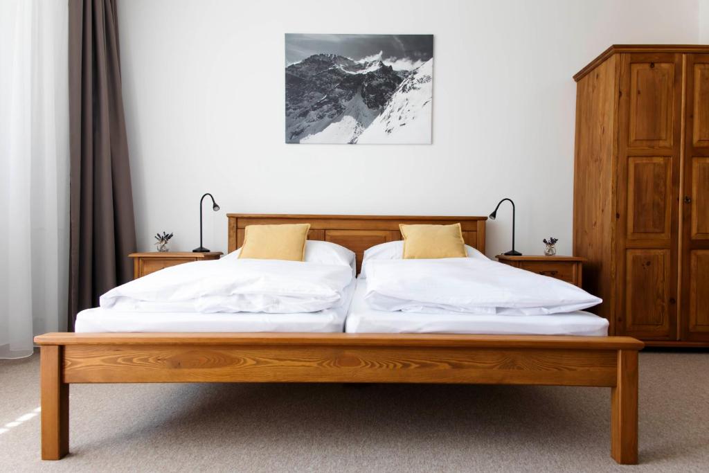 A bed or beds in a room at Chalet Nova Lesna Mountain View