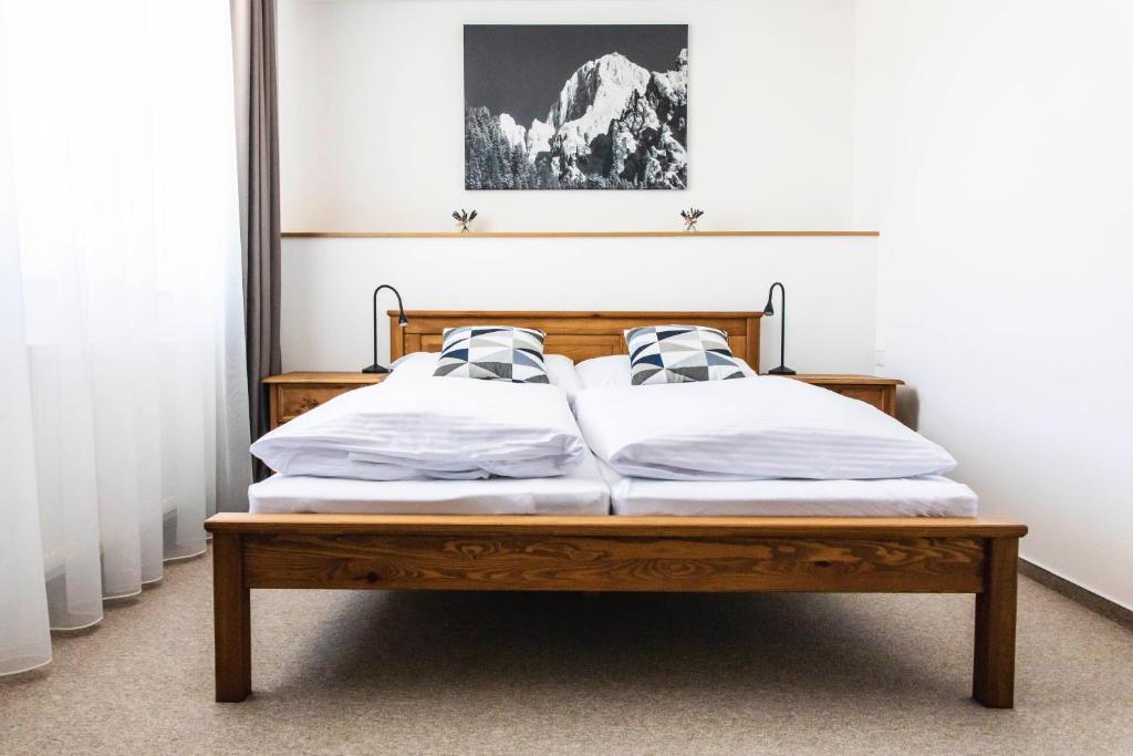 A bed or beds in a room at Chalet Nova Lesna Mountain View