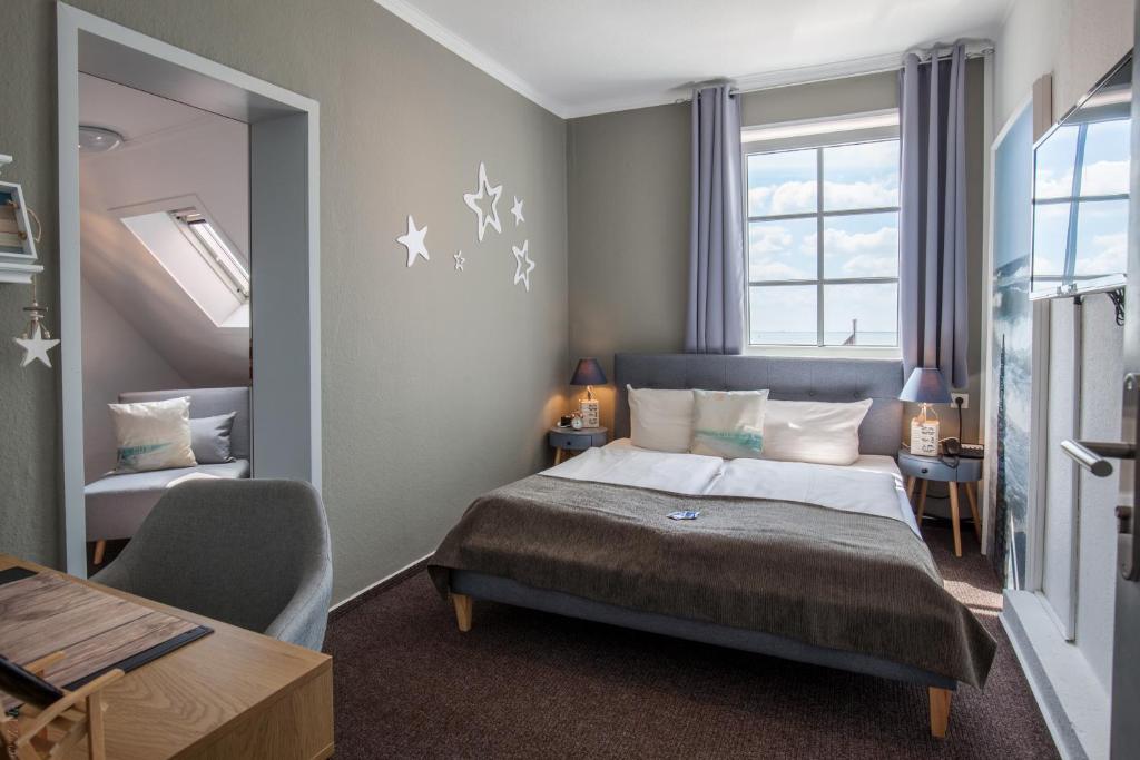 Postel nebo postele na pokoji v ubytování AKZENT Strandhotels Seestern, Delphin & Lachs