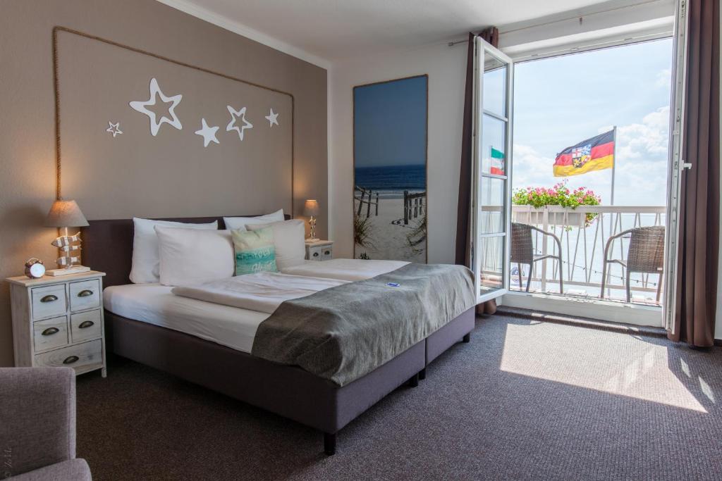 Postel nebo postele na pokoji v ubytování AKZENT Strandhotels Seestern, Delphin & Lachs