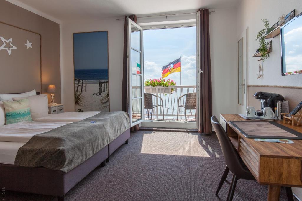 Postel nebo postele na pokoji v ubytování AKZENT Strandhotels Seestern, Delphin & Lachs