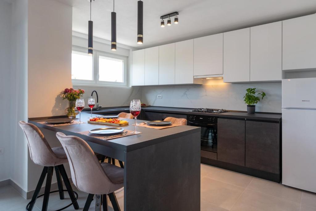 Kuchyňa alebo kuchynka v ubytovaní Ampelea apartment