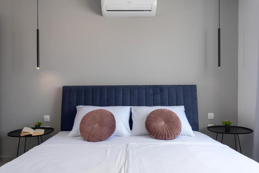 Posteľ alebo postele v izbe v ubytovaní Ampelea apartment