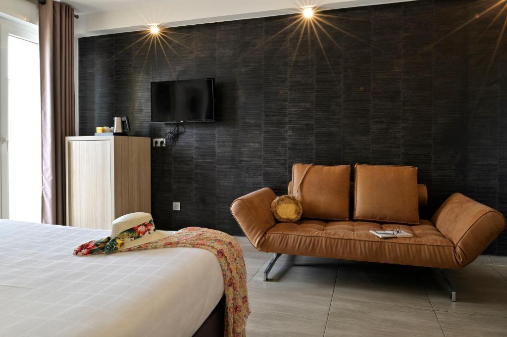 Postel nebo postele na pokoji v ubytování Hôtel L'Escale Coté Port