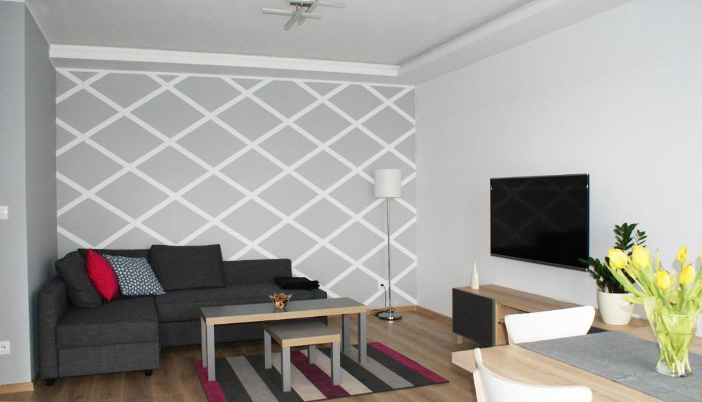 Televízia a/alebo spoločenská miestnosť v ubytovaní Apartament Imagus Oliwa