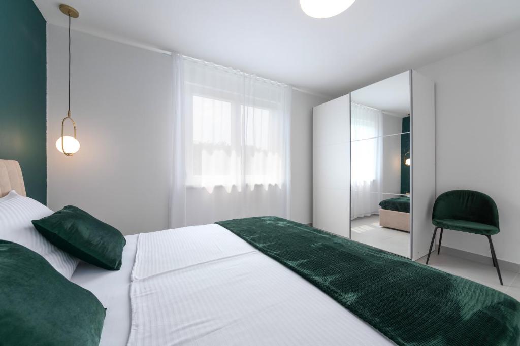 Posteľ alebo postele v izbe v ubytovaní Ampelea apartment