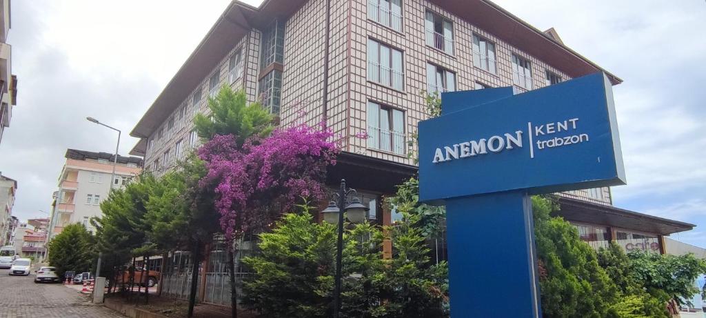 a blue sign in front of a building at Anemon Trabzon Hotel in Trabzon