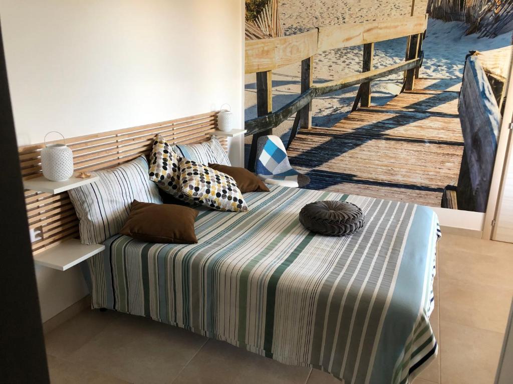 A bed or beds in a room at Tramontana Tre Archi B&B