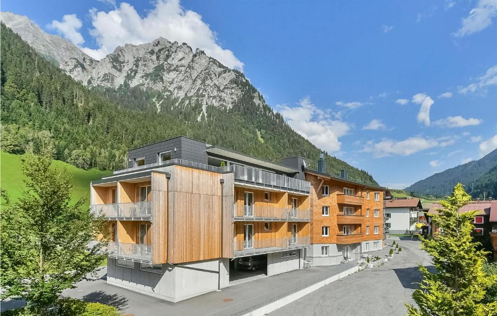 a building with a mountain in the background at 2 Bedroom Stunning Apartment In Klsterle in Klösterle am Arlberg