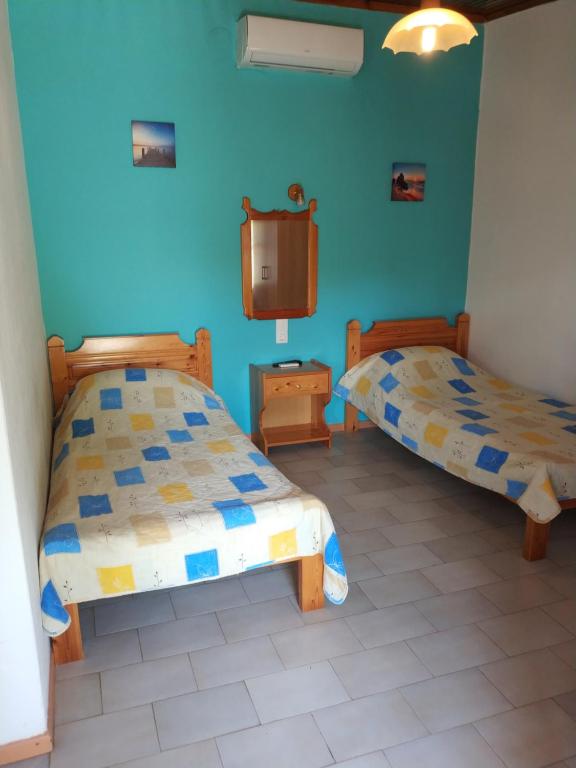 Postel nebo postele na pokoji v ubytování Asimina's House