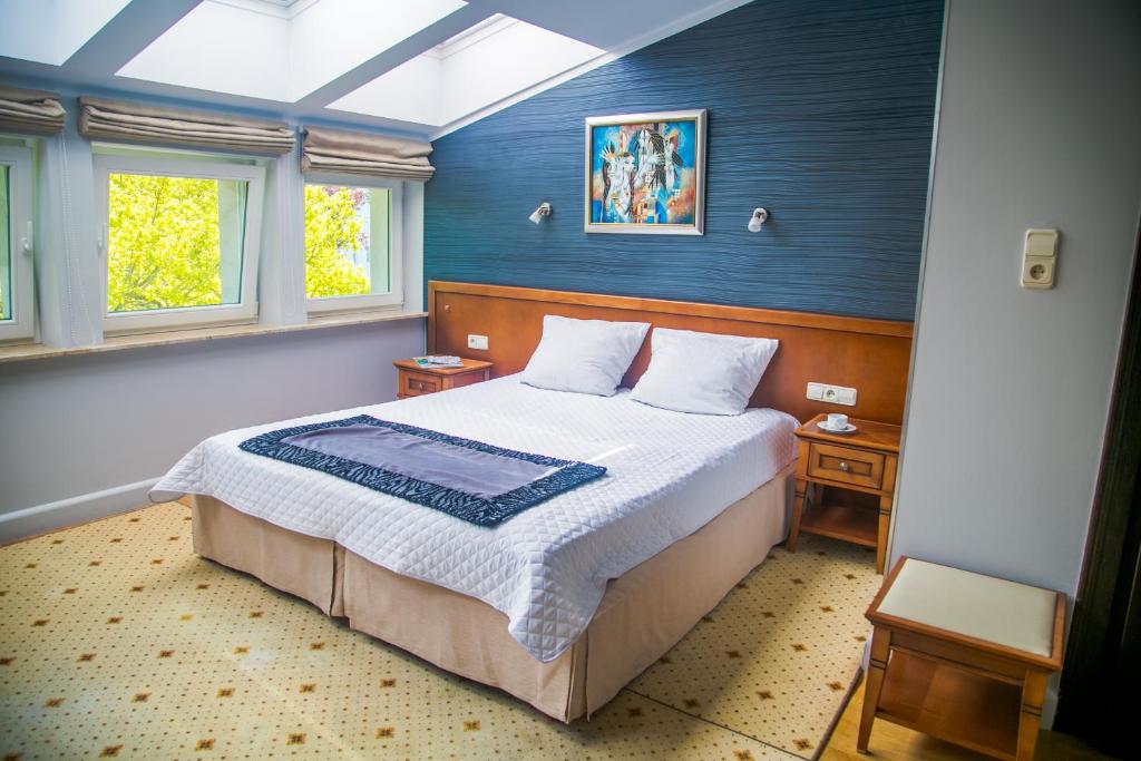 Postel nebo postele na pokoji v ubytování Hotel Apollo