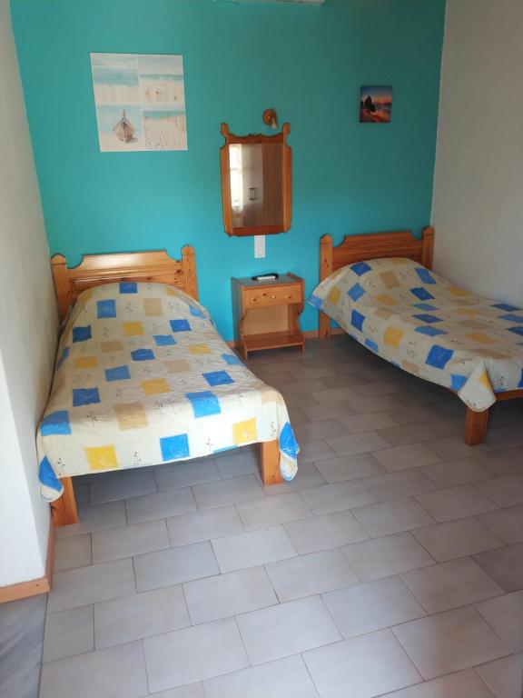 Postel nebo postele na pokoji v ubytování Asimina's House