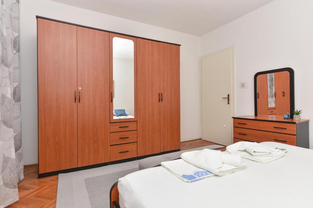 Posteľ alebo postele v izbe v ubytovaní Apartman Moga Dida
